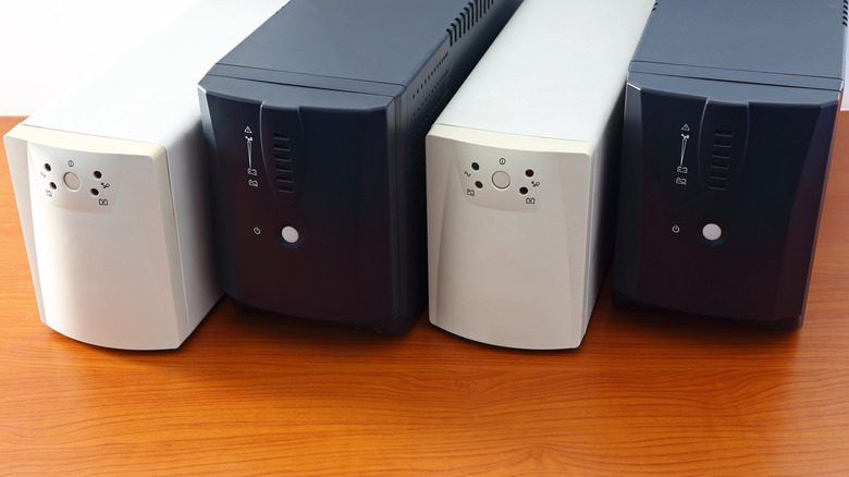 Several UPS units on a table