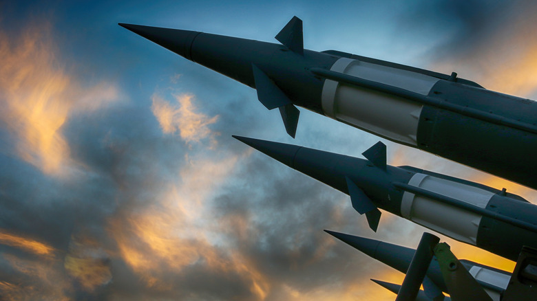 Close up shot of ballistic missiles against a sunset.