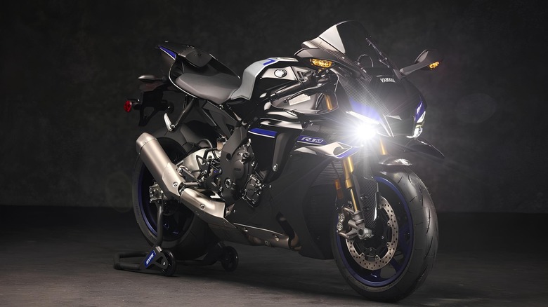 Studio photo of a black Yamaha R1M with blue accents