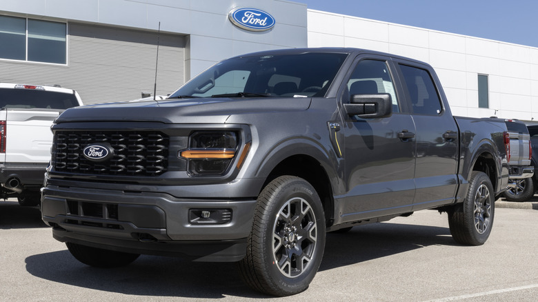 F-150 truck parked outside a Ford dealership