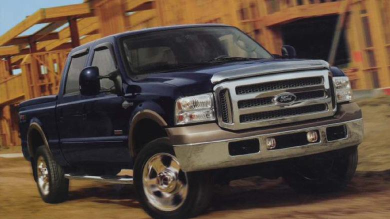 2007 Ford F-250 Super Duty driving on job site, front-right 3/4 view