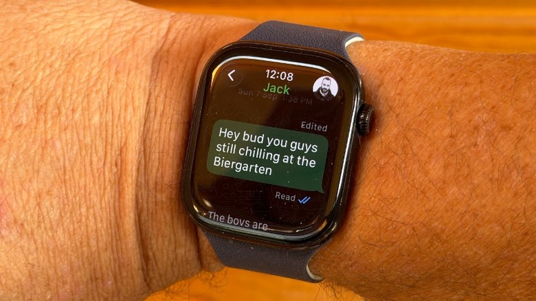 Apple Watch on Adam's wrist with WhatsApp message