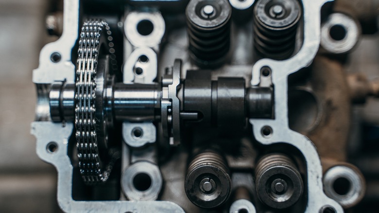Close up view of engine showing camshaft and valve lifters
