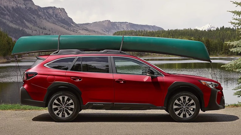 A 2025 Subaru Outback SUV with canoe affixed to the top of the vehicle