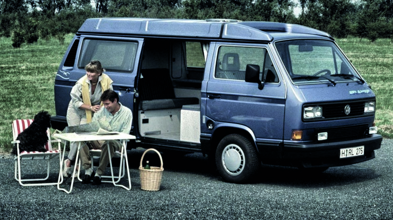 A family with their VW Vanagon Camper