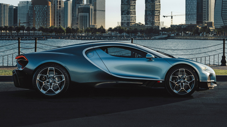 Side view of a Bugatti Turbillon parked next to water