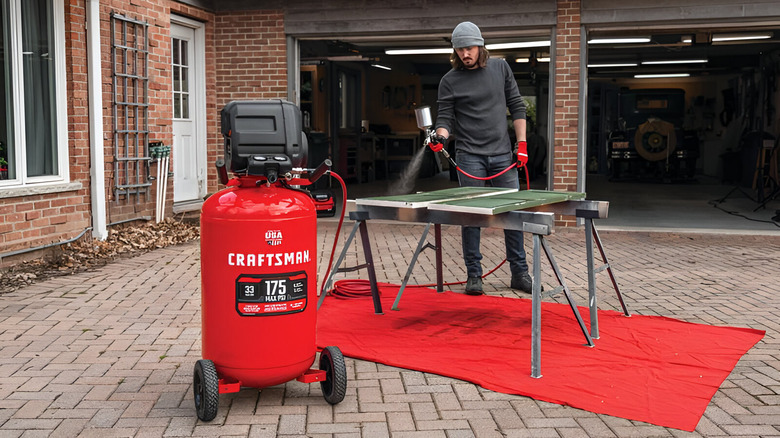 Person using a Craftsman air compressor