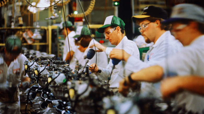 Workers at an assembly line in Honda's Ohio factory