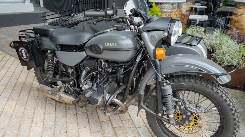 A front view of a grey Russian IMZ-Ural motorcycle with sidecar