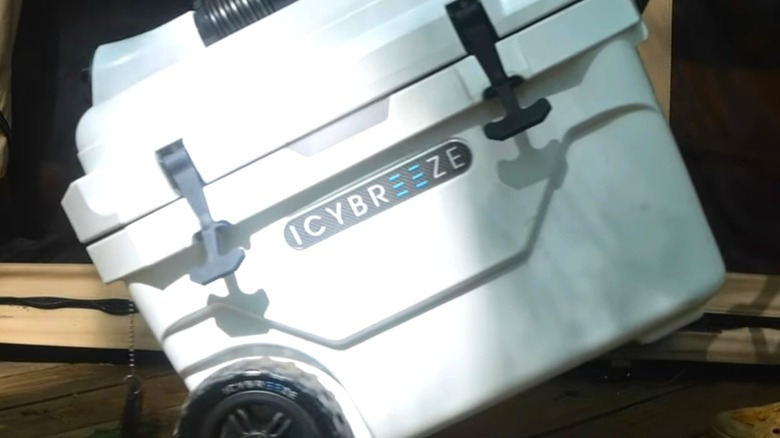 A white IcyBreeze cooler on its wheels