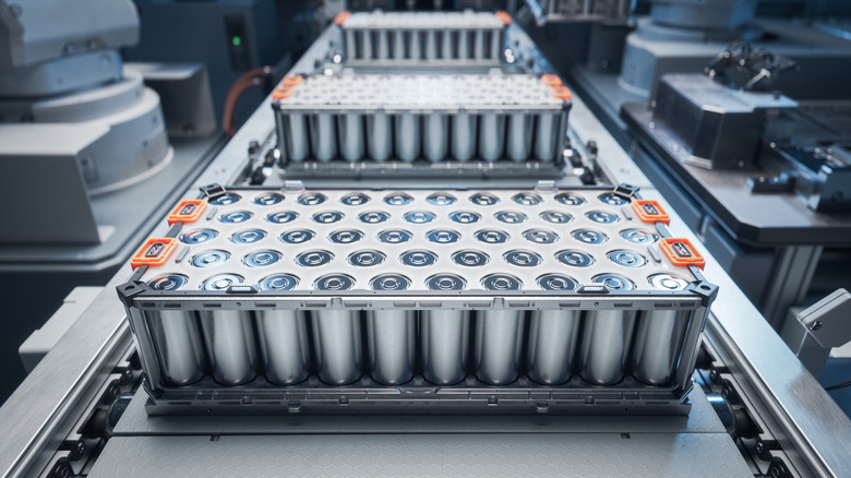 Close-up of lithium-ion high-voltage EV batteries on an assembly line