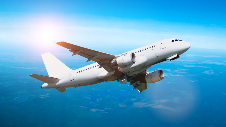 Airplane in flight against a blue sky