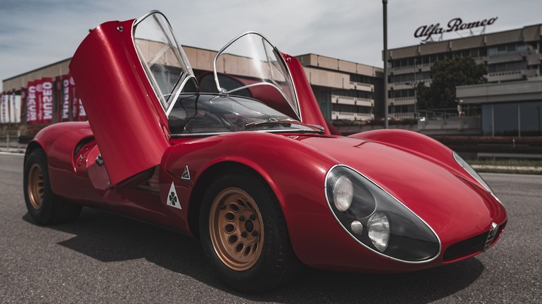 Front three-quarter view of a 1967 Alfa Romeo 33 Stradale with doors open