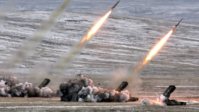 A heavy flamethrower system TOS-1A MRL capable of using thermobaric warheads, mounted on a T-72 tank chassis, in action.