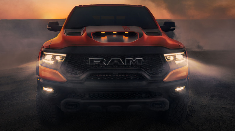 Front view of 2024 Ram 1500 TRX with lights on