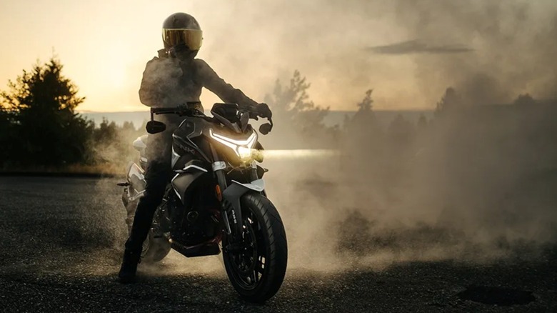 The CFMoto 800NK doing a burnout.