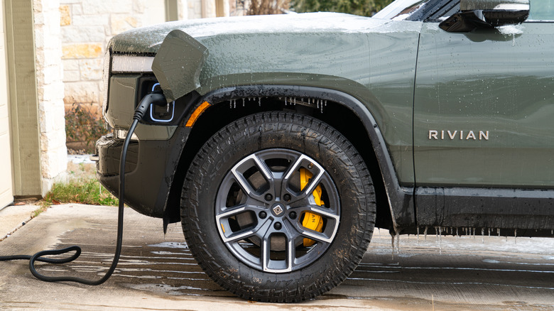 A closeup of a Rivian R1T truck charging