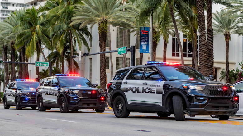 Ford police SUVs on a street.