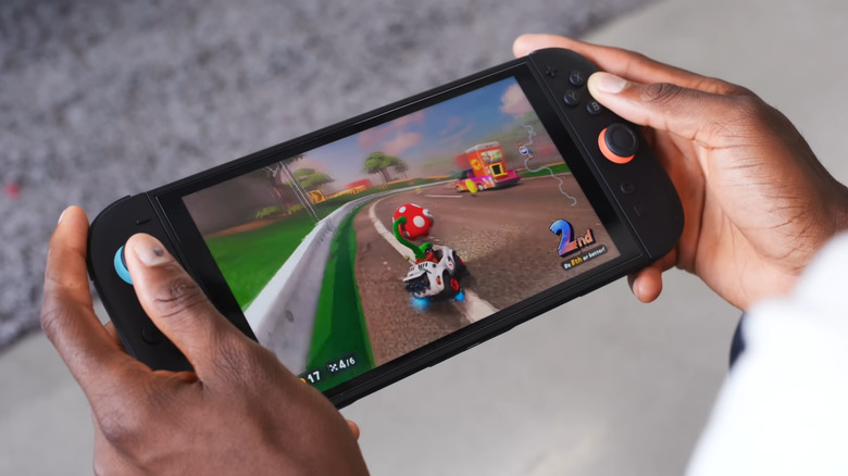 man playing Mario Kart world on Nintendo Switch 2