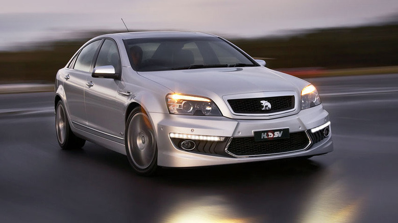 A silver 2010 Holden Grange WM3 sedan in motion