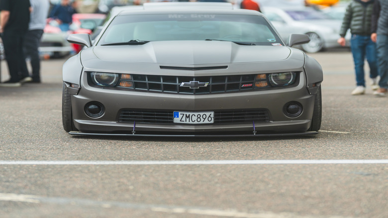 A 2010 Chevrolet Camaro SS with a wide-body kit at a car show