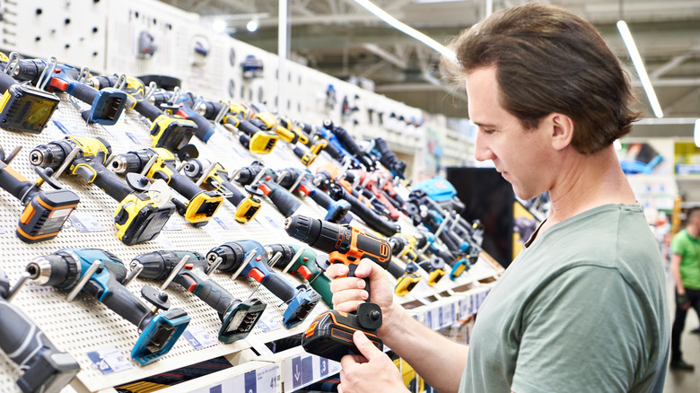 A man browsing power tools in a store