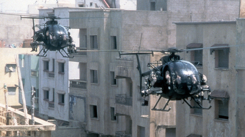 Two helicopters approach combat in the 2001 film 