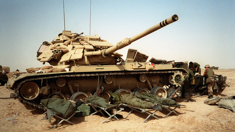 U.S. soldiers napping around an M60 tank during Operation Desert Storm