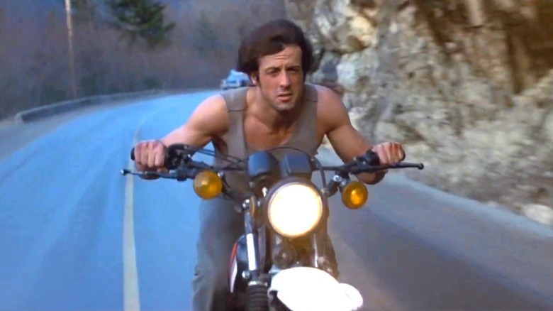 Sylvester Stallone as Rambo on a stolen bike in a 