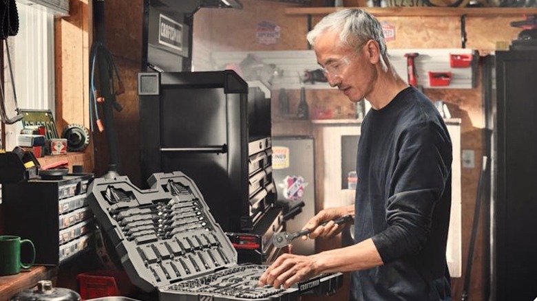 Person looking at his Craftsman socket set in garage