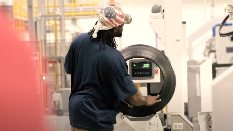 Person working on a GT Radial Tire in US factory