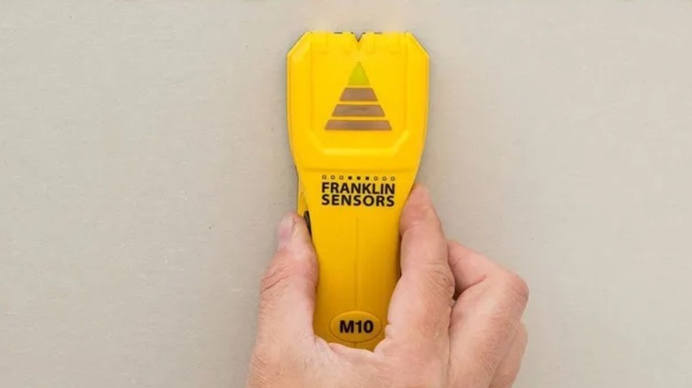 Hand pushes up Franklin Sensors M10