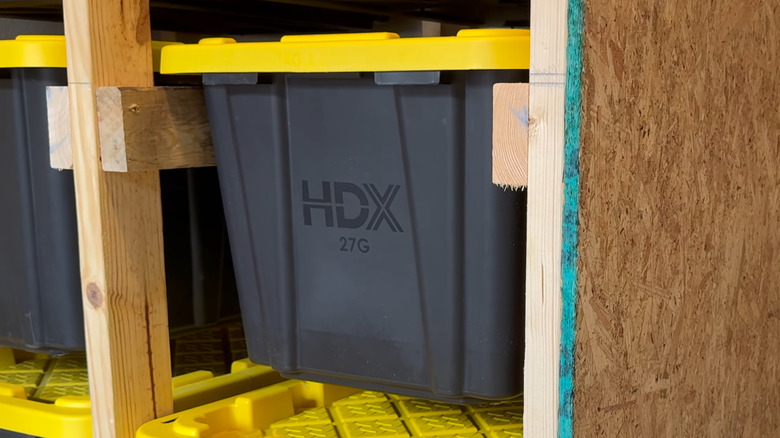 27G HDX storage tote on plywood shelving