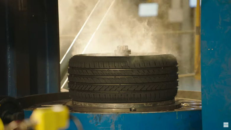 A tire in a factory newly created with smoke around