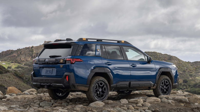 Rear-quarter view of a 2026 Subaru Outback Wilderness off-roading