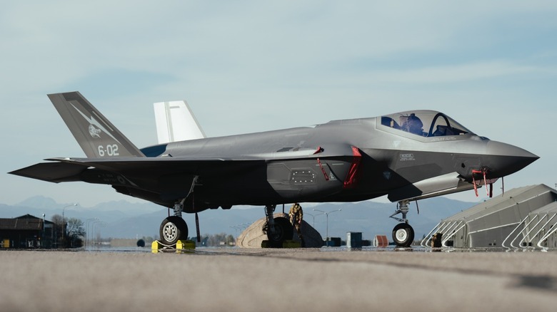 an F-35 parked on the ramp