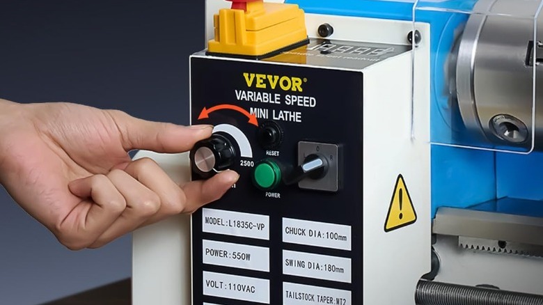Person turning speed dial on Vevor metal lathe