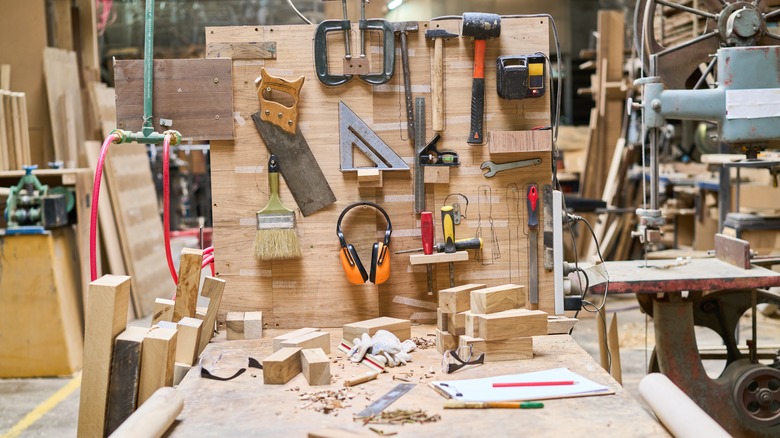A workshop with organized woodworking tools on display