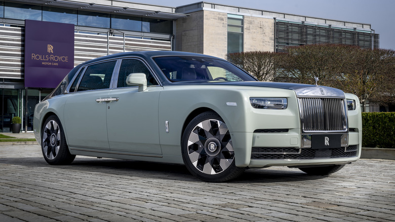 Front 3/4 view of Rolls-Royce Phantom in front of the Goodwood factory