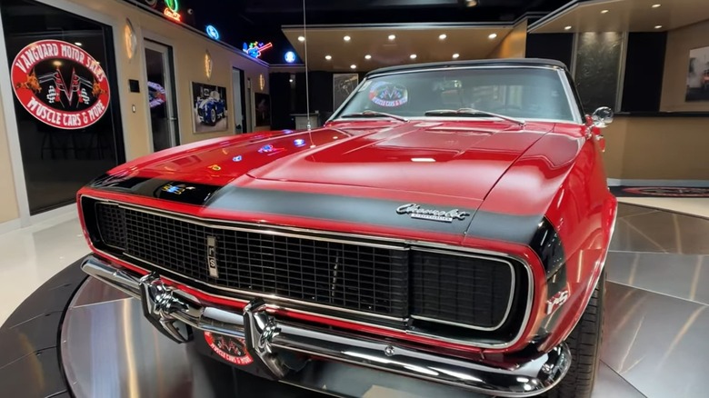 A red 1967 Chevy Camaro on display.