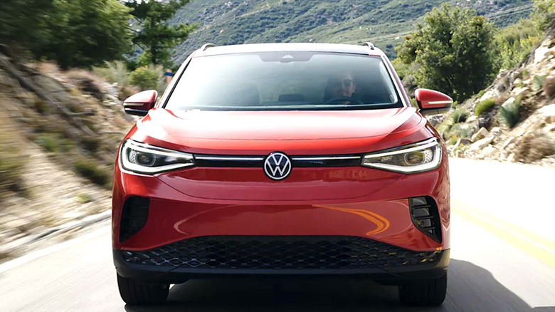 Person driving a Volkswagen through the mountains