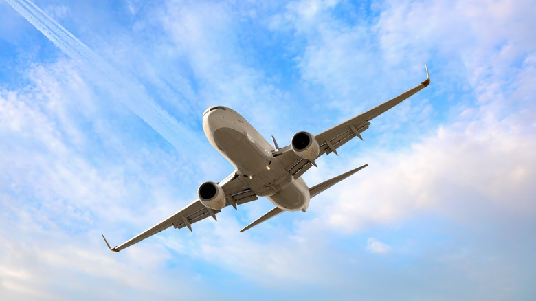 White passenger airplane in the sky