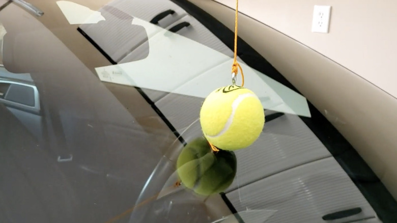 Tennis ball parking marker on car windshield