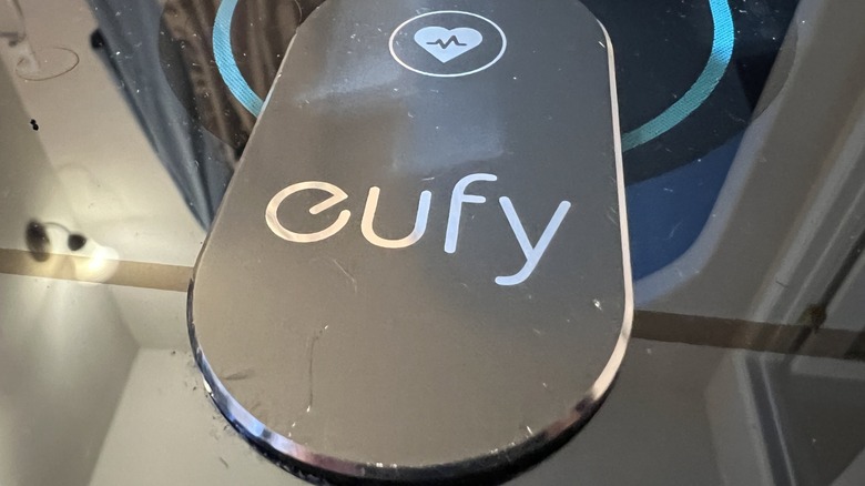 Eufy logo on the reflective surface of a smart scale