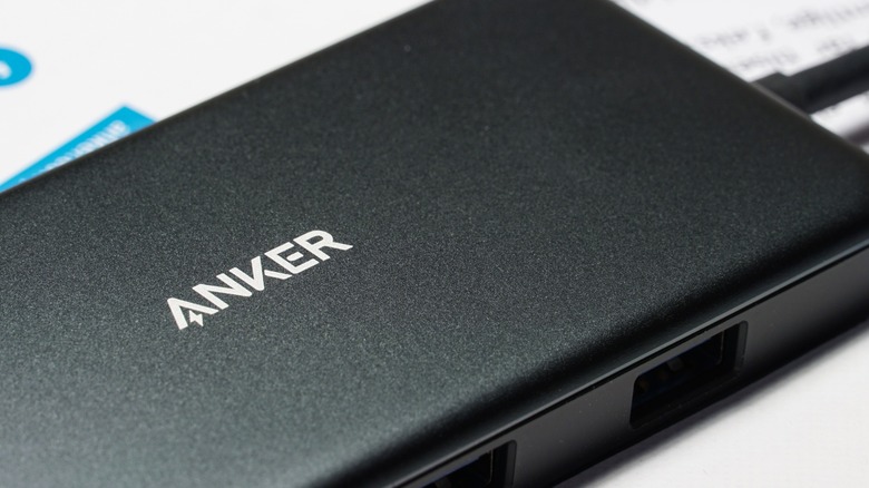 Matte black Anker power bank with a black cable