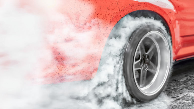 Drag car spinning its wheels