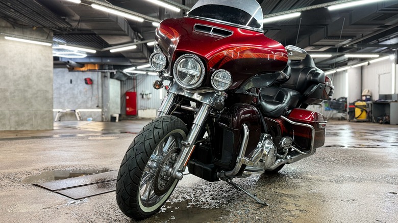 A cherry red Harley Davidson Screaming Eagle 110 in a showroom