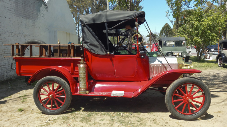 Side view of red Ford Model T pickup truck