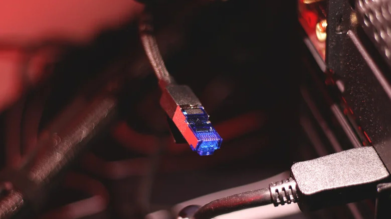 Close up of the RJ45 connector on a black Ethernet cable