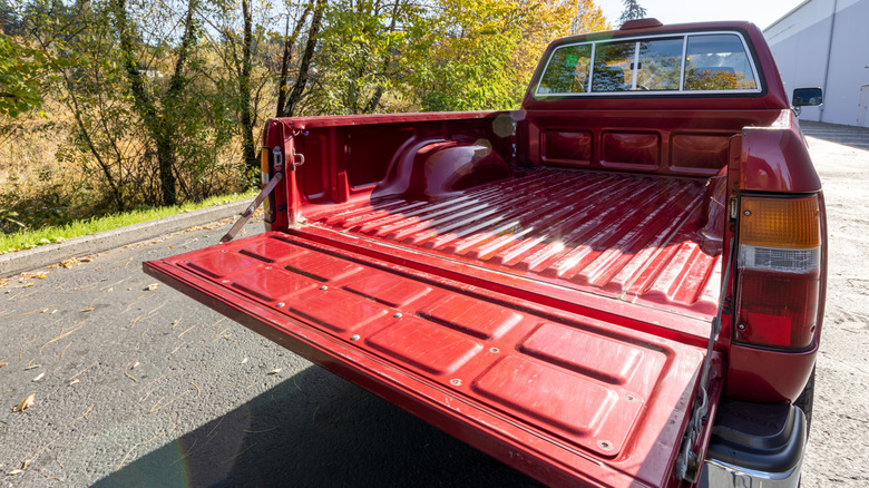 Red Toyota Tacoma SX V6 Xtracab with the tailgate down